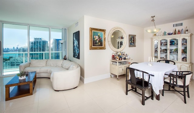 1250 S Miami Ave Unit 3106, Miami, FL 33130 - dining area featuring baseboards, a city view, and floor to ceiling windows