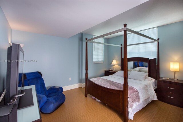 1250 S Miami Ave Unit 3106, Miami, FL 33130 - bedroom featuring wood finished floors, baseboards, and multiple windows