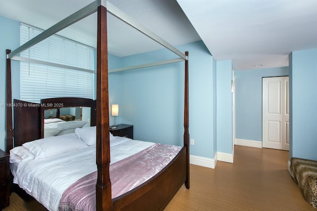 1250 S Miami Ave Unit 3106, Miami, FL 33130 - bedroom featuring baseboards and wood finished floors