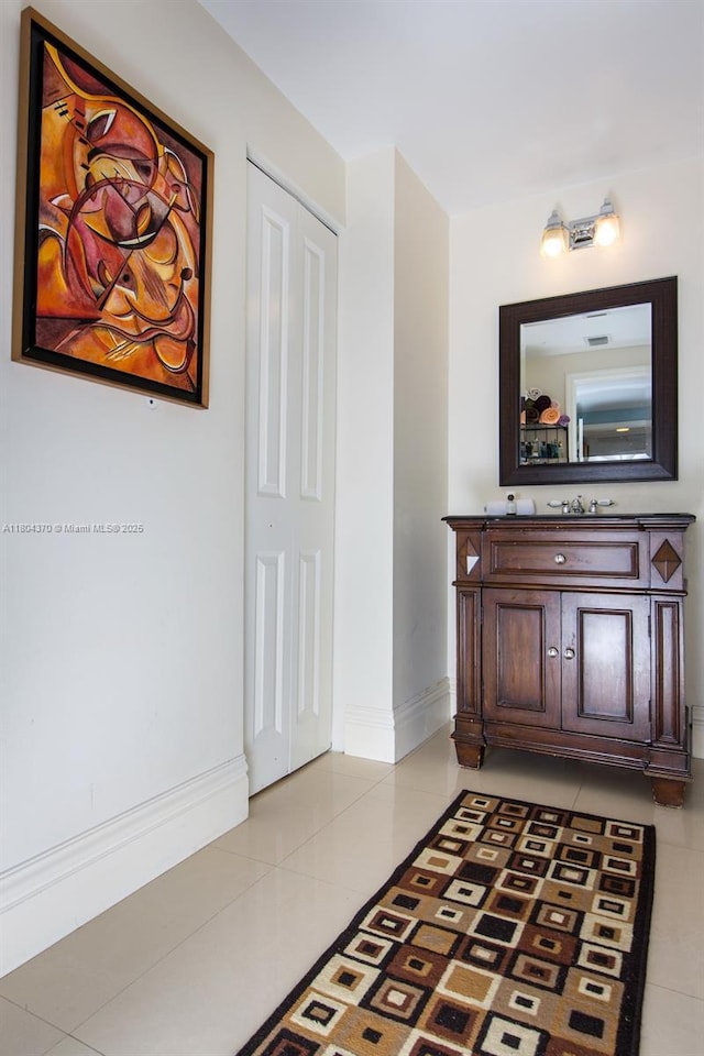 1250 S Miami Ave Unit 3106, Miami, FL 33130 - corridor with light tile patterned floors and baseboards