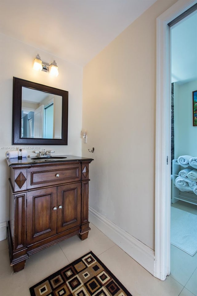 1250 S Miami Ave Unit 3106, Miami, FL 33130 - bathroom featuring baseboards, vanity, and tile patterned floors