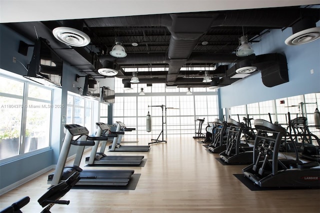 1250 S Miami Ave Unit 3106, Miami, FL 33130 - gym with wood finished floors, healthy amount of natural light, and baseboards