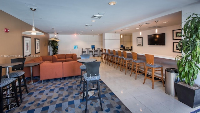 1250 S Miami Ave Unit 3106, Miami, FL 33130 - dining area with tile patterned flooring, a bar, and recessed lighting