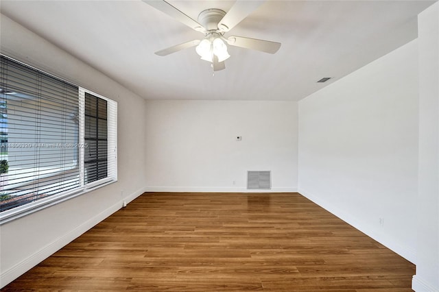 5861 NW 18th Ct, Sunrise, FL 33313 - empty room featuring wood finished floors, baseboards, and ceiling fan