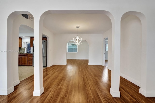 5861 NW 18th Ct, Sunrise, FL 33313 - unfurnished dining area with wood finished floors and baseboards