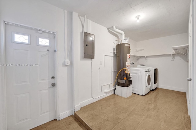 5861 NW 18th Ct, Sunrise, FL 33313 - laundry area featuring electric panel, washer and clothes dryer, gas water heater, and baseboards