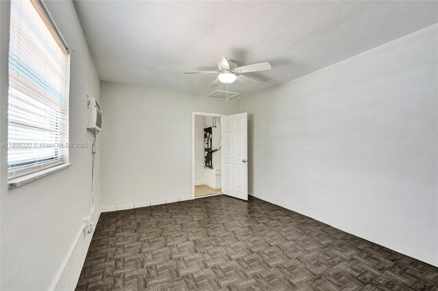5861 NW 18th Ct, Sunrise, FL 33313 - unfurnished room featuring a ceiling fan and an AC wall unit