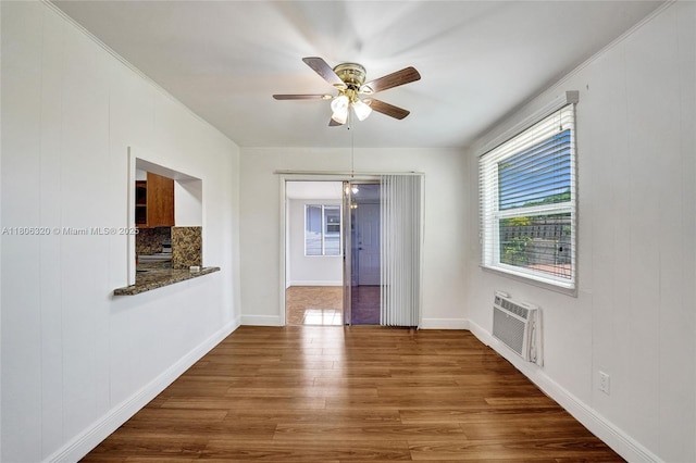 5861 NW 18th Ct, Sunrise, FL 33313 - spare room featuring a wall mounted air conditioner, ceiling fan, wood finished floors, and baseboards