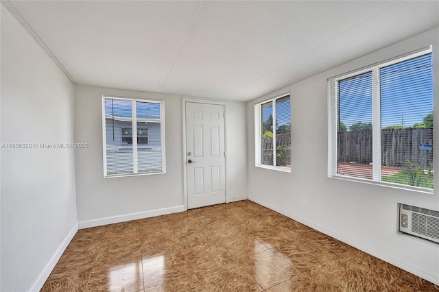 5861 NW 18th Ct, Sunrise, FL 33313 - spare room with plenty of natural light and baseboards