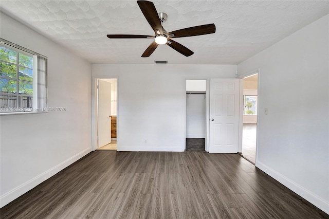 5861 NW 18th Ct, Sunrise, FL 33313 - unfurnished bedroom with wood finished floors, baseboards, ceiling fan, and a closet