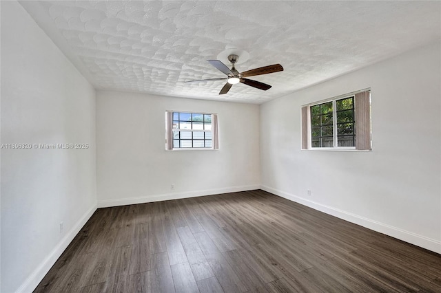 5861 NW 18th Ct, Sunrise, FL 33313 - unfurnished room with dark wood-type flooring, baseboards, a ceiling fan, and a textured ceiling