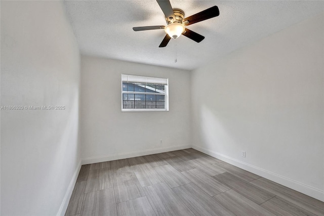 5861 NW 18th Ct, Sunrise, FL 33313 - unfurnished room with a textured ceiling, wood finished floors, ceiling fan, and baseboards