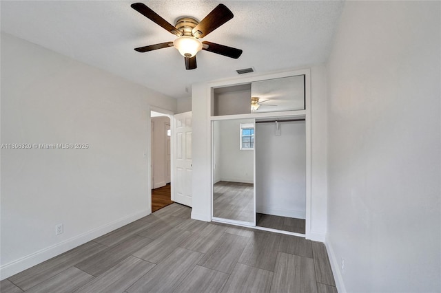 5861 NW 18th Ct, Sunrise, FL 33313 - unfurnished bedroom featuring baseboards, a closet, and wood finished floors