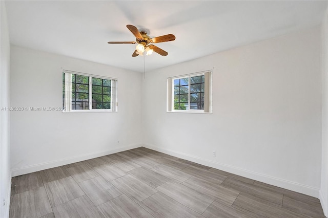 5861 NW 18th Ct, Sunrise, FL 33313 - empty room with a ceiling fan, baseboards, and wood finished floors