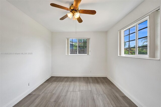 5861 NW 18th Ct, Sunrise, FL 33313 - empty room featuring wood finished floors, baseboards, and a ceiling fan