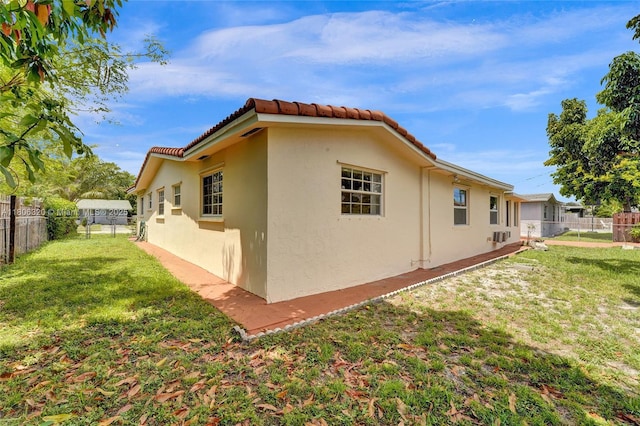 5861 NW 18th Ct, Sunrise, FL 33313 - view of side of property with stucco siding and a tile roof