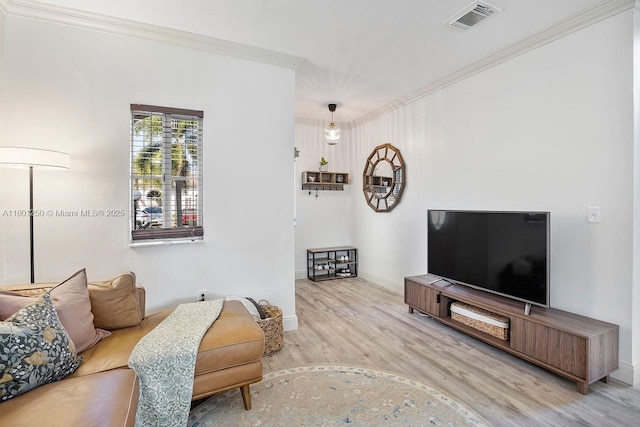 1136 NE 41st Ave, Homestead, FL 33033 - living area featuring ornamental molding, wood finished floors, and baseboards