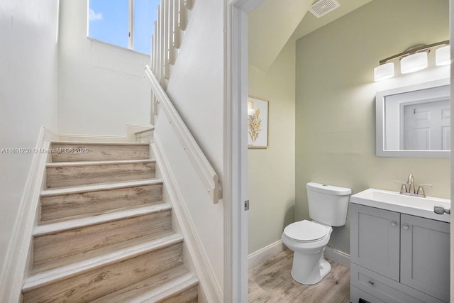 1136 NE 41st Ave, Homestead, FL 33033 - bathroom featuring toilet, wood finished floors, vanity, and baseboards