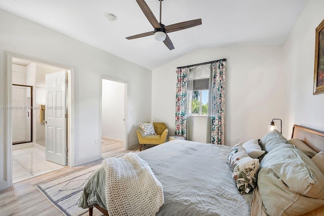 1136 NE 41st Ave, Homestead, FL 33033 - bedroom with vaulted ceiling, light wood-type flooring, baseboards, ceiling fan, and ensuite bath