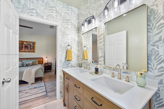 1136 NE 41st Ave, Homestead, FL 33033 - ensuite bathroom featuring wallpapered walls and double vanity