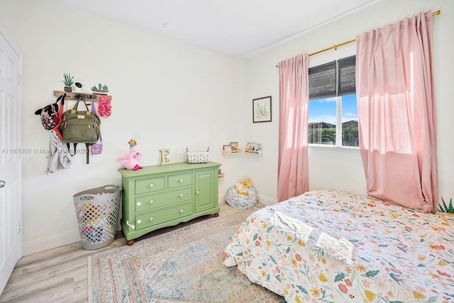 1136 NE 41st Ave, Homestead, FL 33033 - bedroom featuring light wood finished floors and baseboards