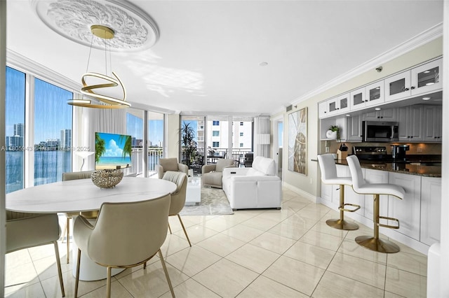 18000 N Bay Rd Unit 803, Sunny Isles Beach, FL 33160 - dining space with ornamental molding, baseboards, and light tile patterned flooring