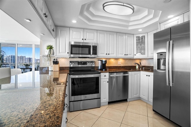 18000 N Bay Rd Unit 803, Sunny Isles Beach, FL 33160 - kitchen featuring stainless steel appliances, tasteful backsplash, glass insert cabinets, white cabinetry, and recessed lighting