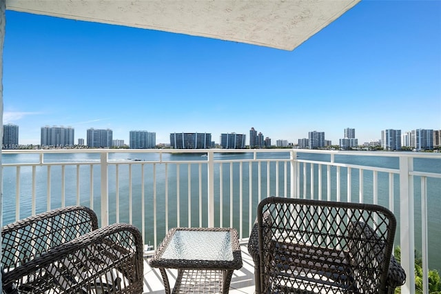 18000 N Bay Rd Unit 803, Sunny Isles Beach, FL 33160 - balcony featuring a view of skyline and a water view