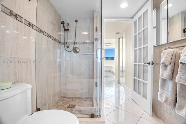 18000 N Bay Rd Unit 803, Sunny Isles Beach, FL 33160 - full bathroom with toilet, a shower stall, and tile patterned flooring