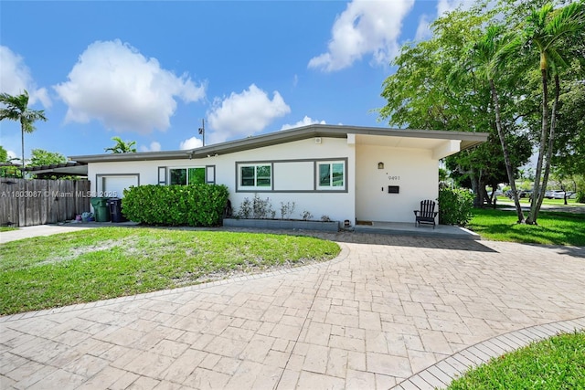 9491 SW 54th St, Miami, FL 33165 - single story home with decorative driveway, stucco siding, and a garage