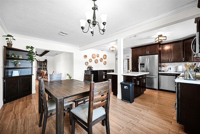 9491 SW 54th St, Miami, FL 33165 - dining room with a chandelier, light wood finished floors, and crown molding