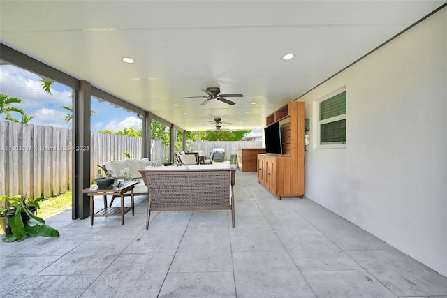 9491 SW 54th St, Miami, FL 33165 - fenced backyard with a patio area, ceiling fan, and an outdoor living space