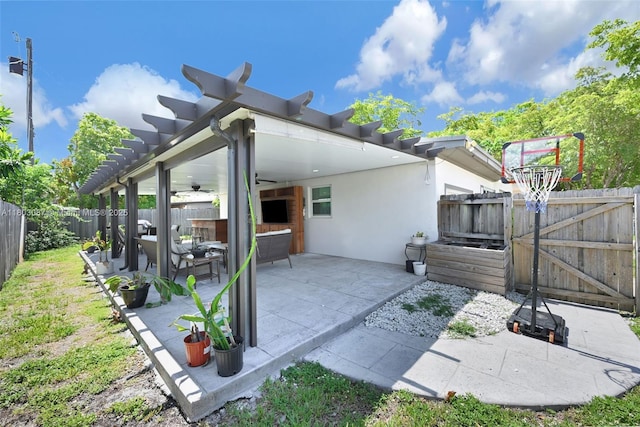 9491 SW 54th St, Miami, FL 33165 - back of house featuring ceiling fan, a fenced backyard, a patio area, a gate, and stucco siding