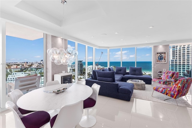 300 S Pointe Dr Unit 2005, Miami Beach, FL 33139 - dining space featuring floor to ceiling windows, a water view, a chandelier, tile patterned floors, and recessed lighting