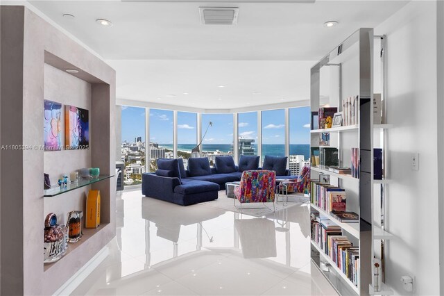 300 S Pointe Dr Unit 2005, Miami Beach, FL 33139 - tiled living room with a water view and floor to ceiling windows