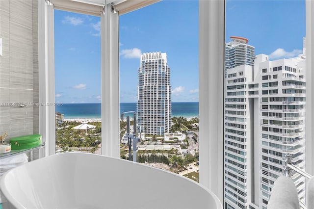 300 S Pointe Dr Unit 2005, Miami Beach, FL 33139 - interior space with a freestanding tub, a water view, and healthy amount of natural light
