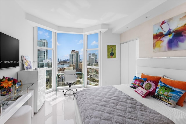 300 S Pointe Dr Unit 2005, Miami Beach, FL 33139 - bedroom featuring a skyline view, tile patterned floors, and a closet