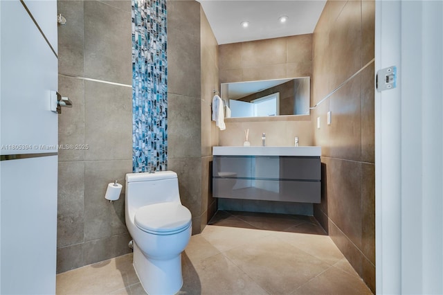 300 S Pointe Dr Unit 2005, Miami Beach, FL 33139 - bathroom with tile walls, vanity, tile patterned floors, and pet washing station