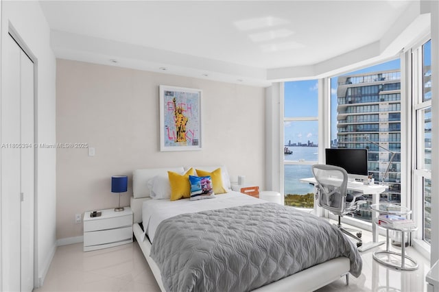 300 S Pointe Dr Unit 2005, Miami Beach, FL 33139 - tiled bedroom featuring baseboards and a desk