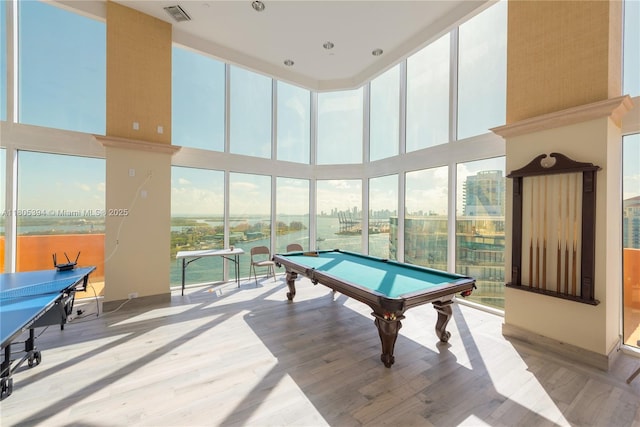 300 S Pointe Dr Unit 2005, Miami Beach, FL 33139 - rec room featuring a towering ceiling, wood finished floors, and pool table
