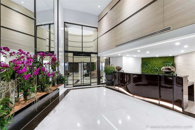 300 S Pointe Dr Unit 2005, Miami Beach, FL 33139 - building lobby featuring a towering ceiling and recessed lighting
