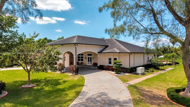 4800 SW 141st Ave, Miramar, FL 33027 - view of front of home featuring decorative driveway, a front yard, and stucco siding