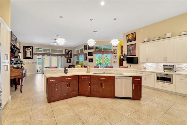 4800 SW 141st Ave, Miramar, FL 33027 - kitchen with stainless steel appliances, a sink, light countertops, and backsplash