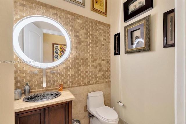4800 SW 141st Ave, Miramar, FL 33027 - bathroom featuring tile walls, toilet, and vanity