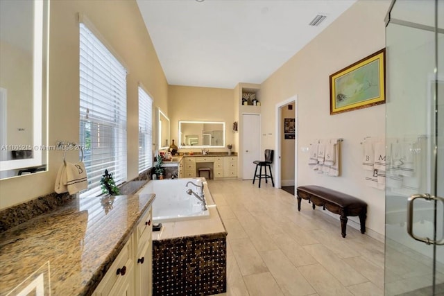 4800 SW 141st Ave, Miramar, FL 33027 - full bathroom with a garden tub, a shower stall, vanity, and baseboards