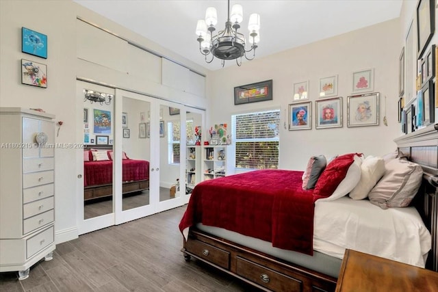 4800 SW 141st Ave, Miramar, FL 33027 - bedroom with a chandelier, french doors, wood finished floors, and access to outside