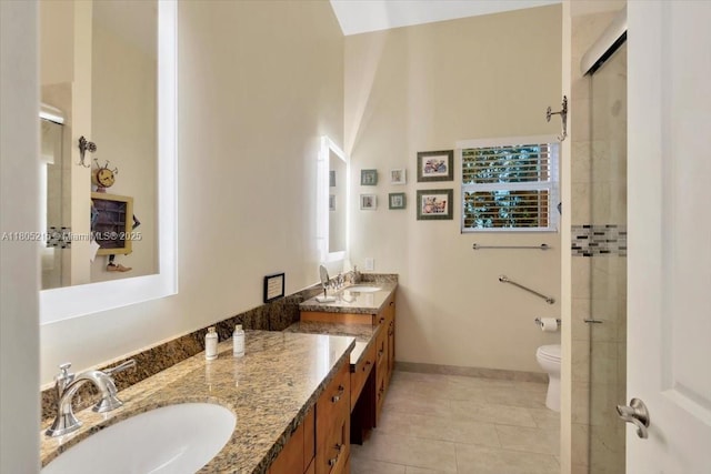4800 SW 141st Ave, Miramar, FL 33027 - bathroom featuring double vanity, tile patterned floors, a tile shower, toilet, and baseboards