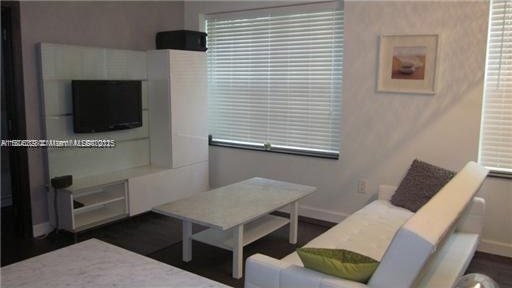 1242 Drexel Ave Unit 103, Miami Beach, FL 33139 - living area featuring baseboards