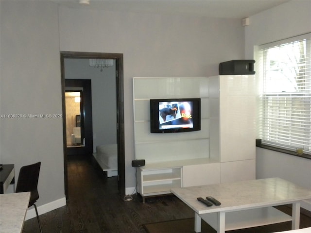 1242 Drexel Ave Unit 103, Miami Beach, FL 33139 - living room with dark wood finished floors and baseboards