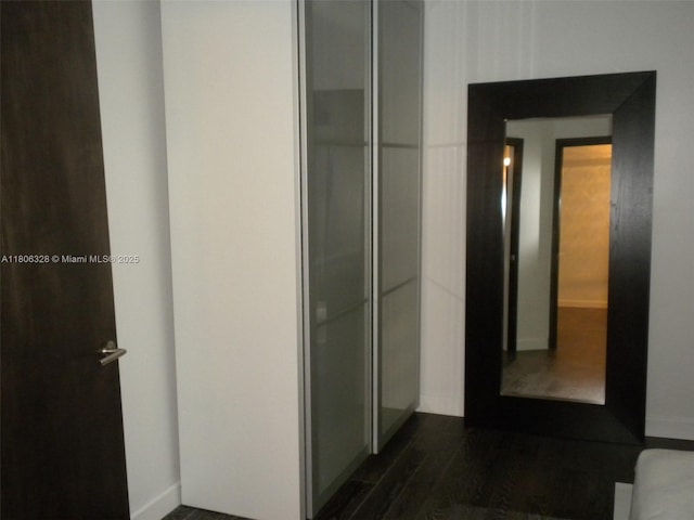 1242 Drexel Ave Unit 103, Miami Beach, FL 33139 - hallway with dark wood-style floors and baseboards